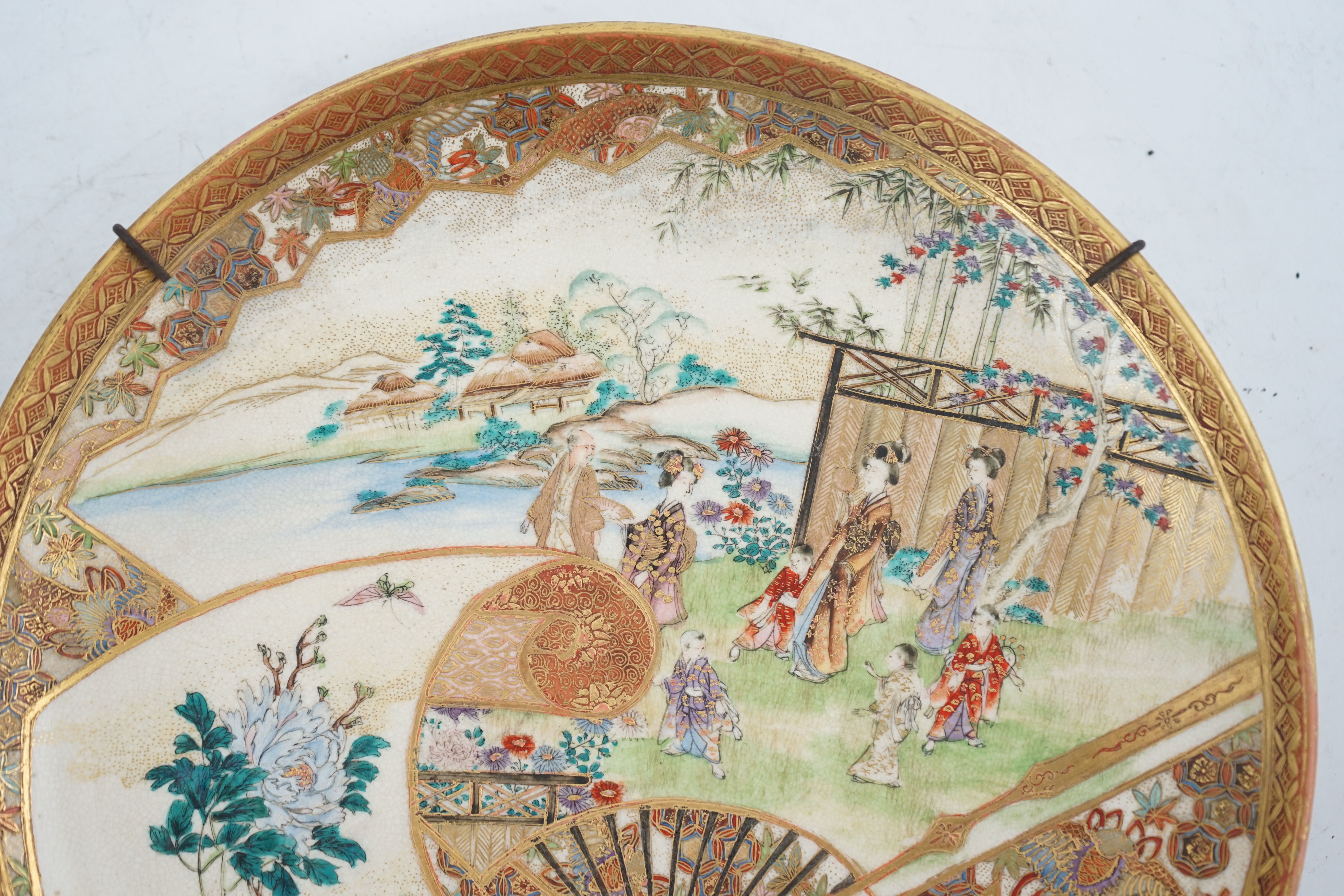 A Japanese Satsuma ‘garden scene’ dish, Meiji period